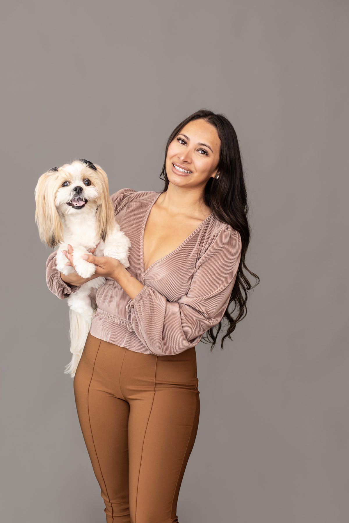 Thania Perez holding her dog